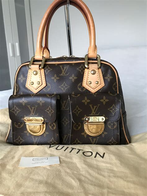 LOUIS VUITTON Monogram Manhattan PM .